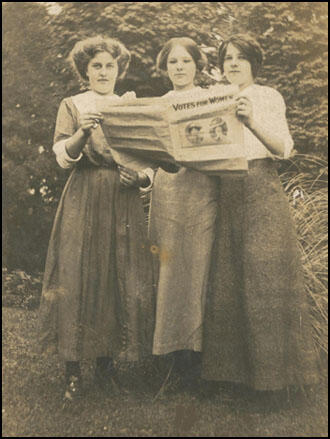 Three of Emily's daughters reading Votes for Women (January 1908)